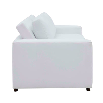 White velvet sofa with modern square arms, two matching cushions, and low dark legs.