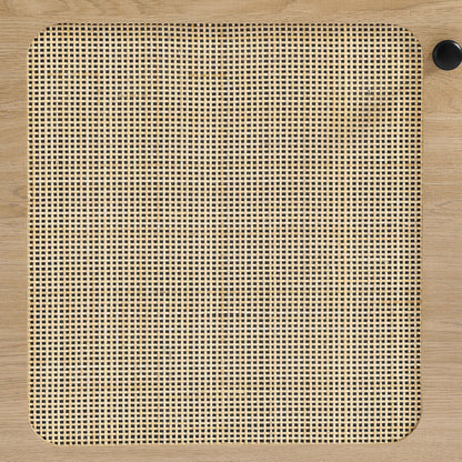 Oak-finish square panel with rounded corners and woven cane grid center; black knob at top-right.