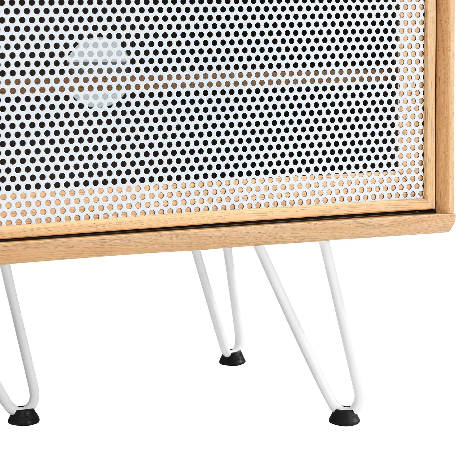Brown oak-framed TV stand with perforated metal front and white hairpin legs, mid-century modern style.