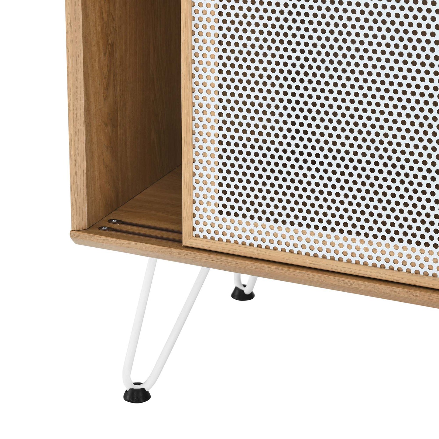 Oak wood cabinet with perforated white metal front panel and slender white hairpin legs.