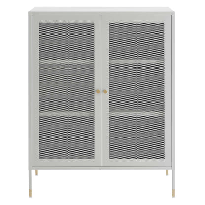 Light gray metal storage cabinet with two mesh doors, gold knobs, and slim legs with brass tips.