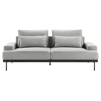 Light gray fabric sofa with slim metal legs, two-seat cushions, two back cushions and two rectangular throw pillows.