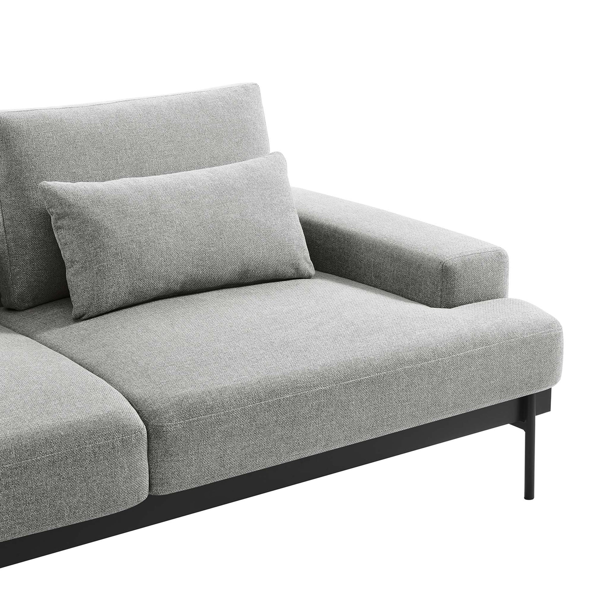Light gray fabric sofa with rectangular cushions, a low-profile arm, and black metal legs.