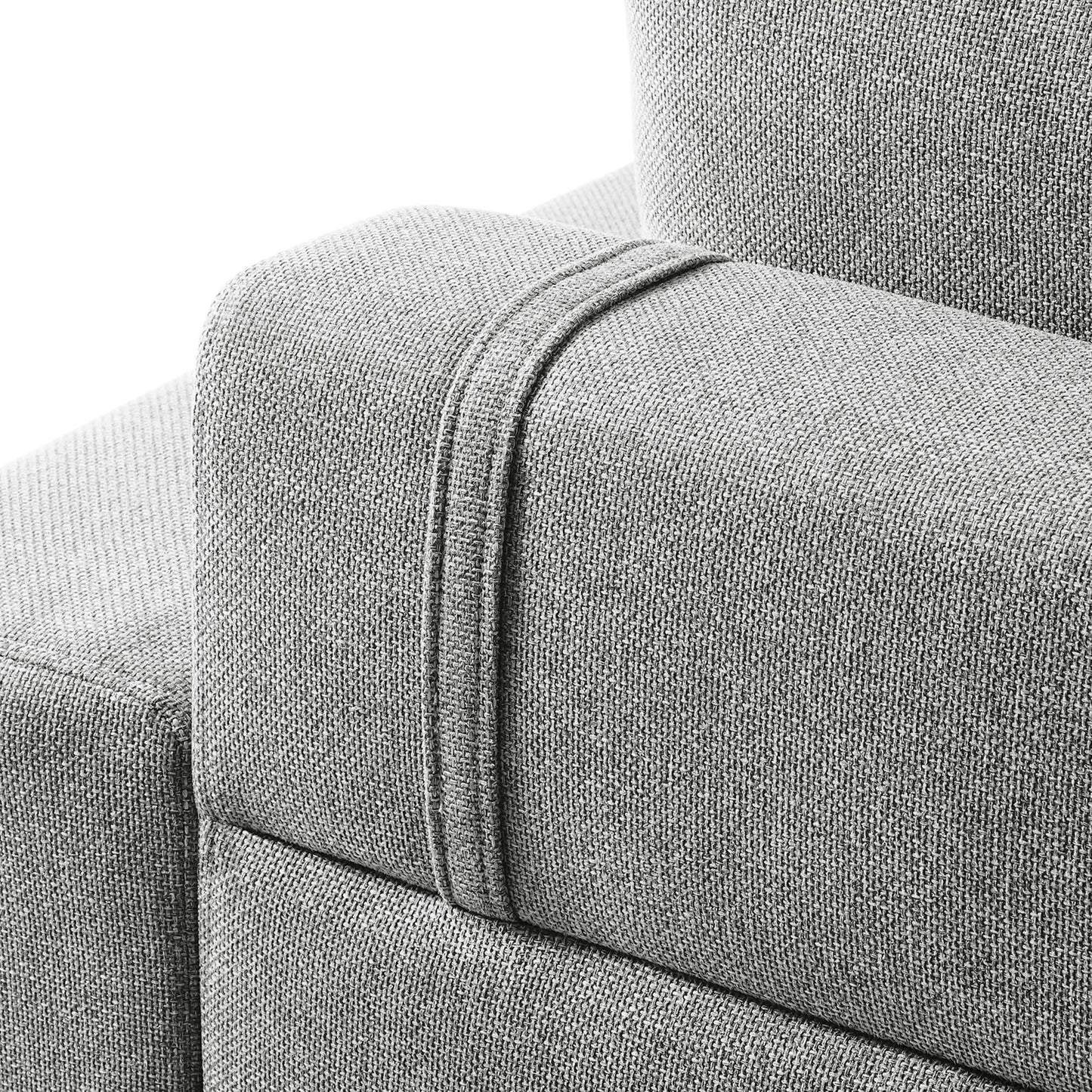 Light gray textured fabric sofa arm with a raised strap seam detail.