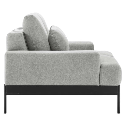 Light gray fabric loveseat with black metal legs, mid-century style, low arms and two plush back cushions.
