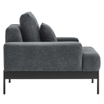 Charcoal gray fabric armchair with slim black metal frame, low-profile arms & plush cushions.