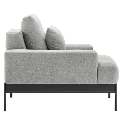Light gray fabric armchair with black metal legs, low-profile frame, cushioned back & seats for modern living room.