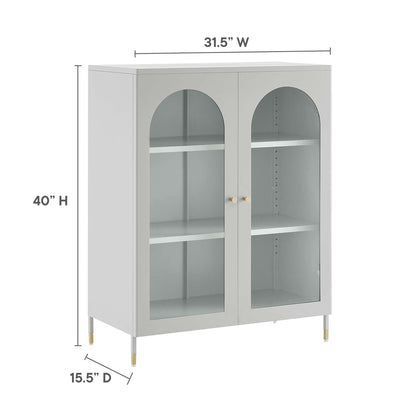 Light gray cabinet with two glass doors, arched top panels, interior shelves, brass legs, 31.5W x 40H x 15.5D.