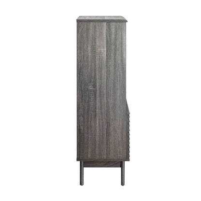 Tall gray-washed wood display cabinet bookshelf on slender legs with vertical plank panels, rustic modern storage.