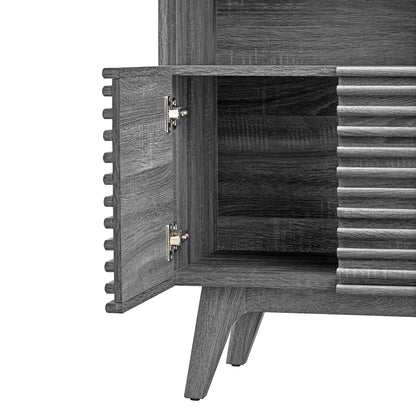 Grey-washed wood display cabinet bookshelf with open door, visible hinges, ribbed slat panel, and tapered legs.