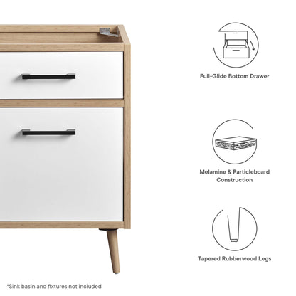 24" bathroom vanity cabinet with an oak wood frame, white drawer fronts, & black bar handles; two-drawer configuration on tapered rubberwood legs.