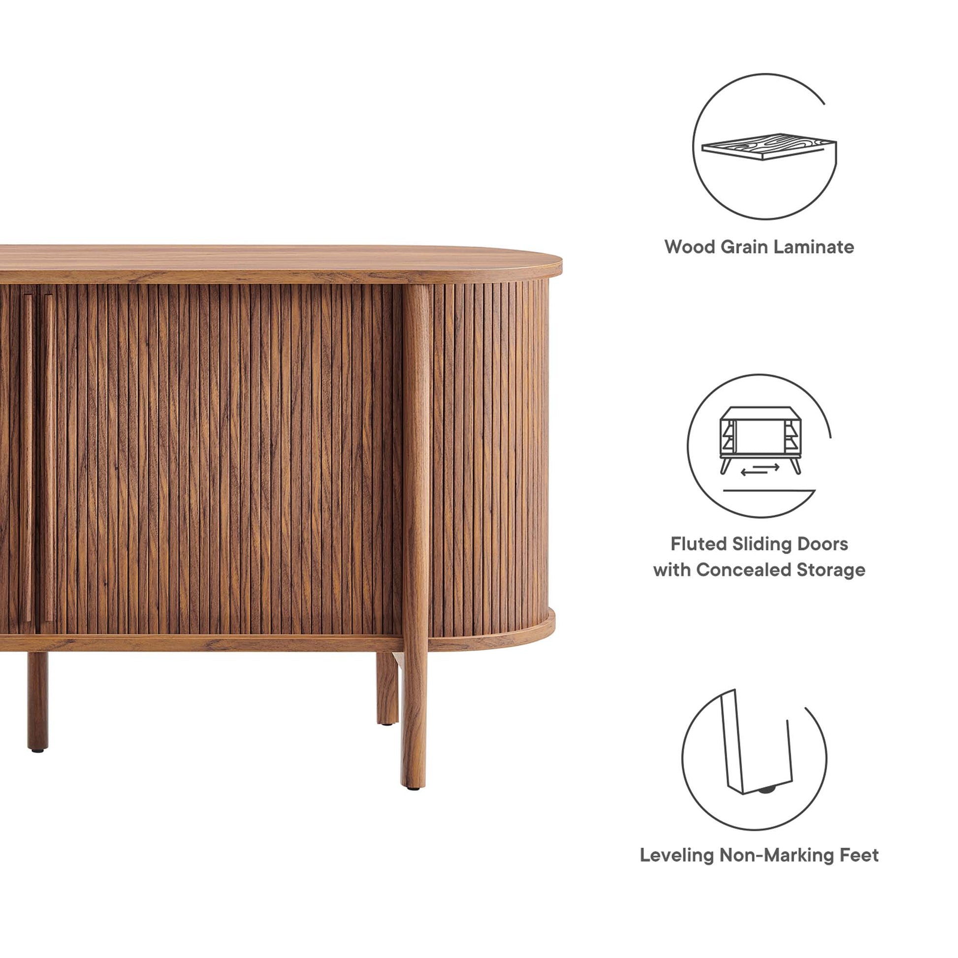 Walnut wood grain laminate credenza with fluted panels, curved front, sliding doors, concealed storage, leveling feet.