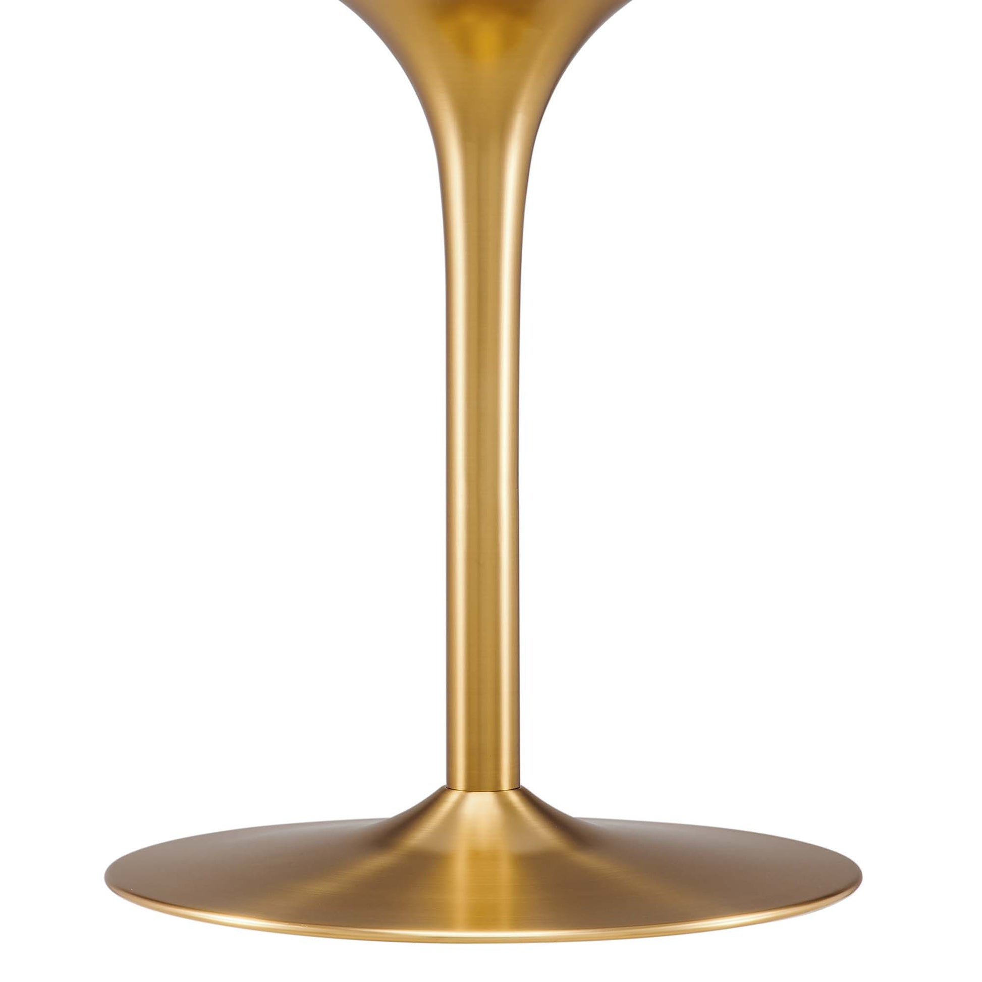 Gold finish pedestal with a round base for a modern dining table.