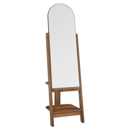 Walnut-finish full-length freestanding mirror with arched top and side supports on a wooden stand with a lower shelf.