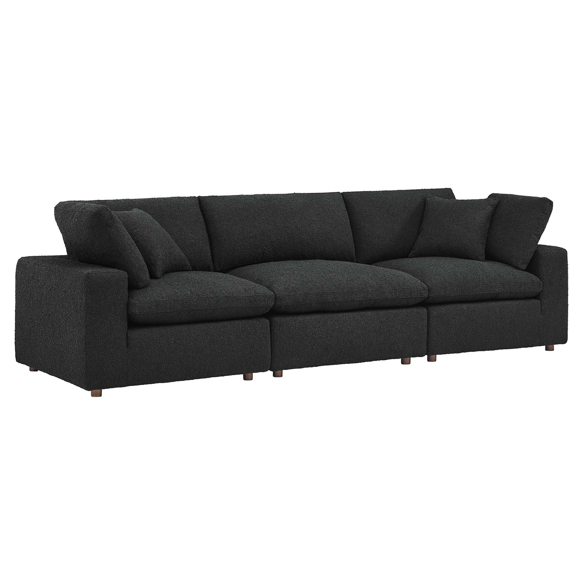 Black boucle fabric 3-Seater sofa with three seat cushions, matching back cushions, boxy arms and wooden legs.