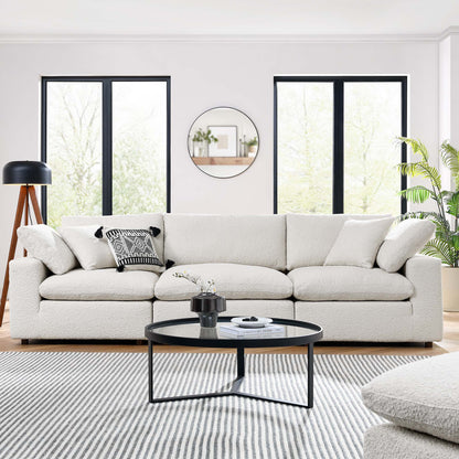 Ivory 3-Seater sofa with neutral pillows in a sunny living room; round coffee table, striped rug, circular mirror, windows.
