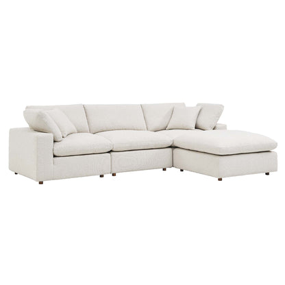 Ivory boucle fabric L-shaped sectional sofa with chaise, plush cushions and short wooden legs.