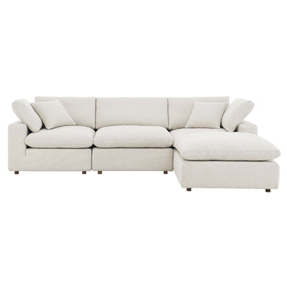 Ivory textured fabric sectional sofa with chaise, L-shaped, cushioned backrests and throw pillows, short wooden legs.
