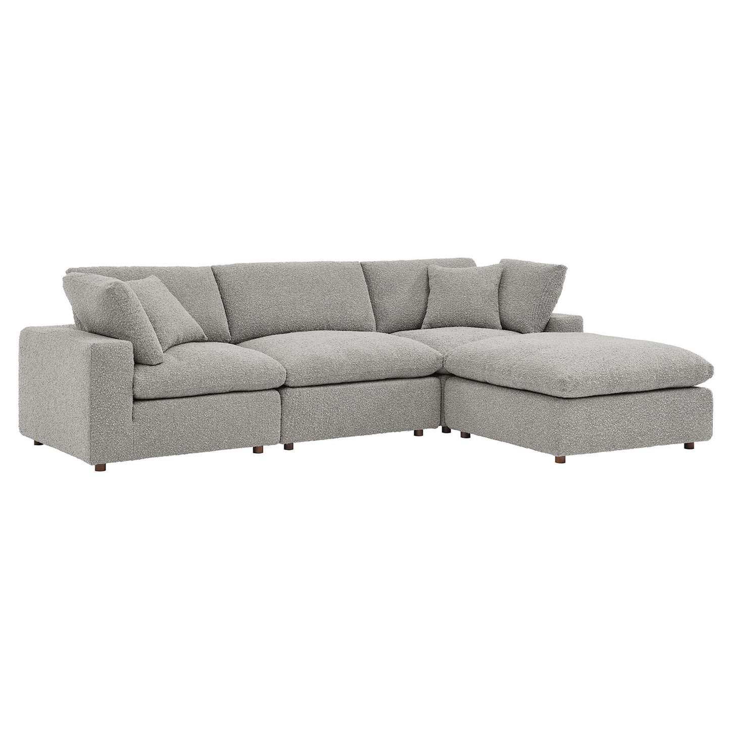 Grey fabric L-shaped sectional sofa with right-side chaise, plush cushions, modern low-profile wooden legs.