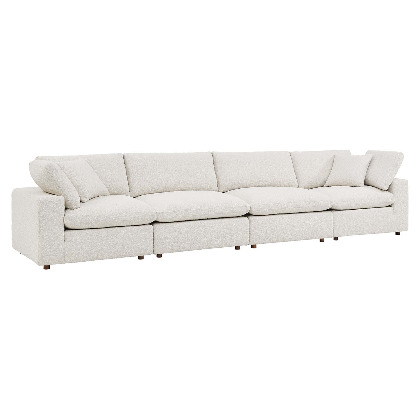 Ivory fabric sofa with plush cushions and low square arms; a modern straight-line living room piece.
