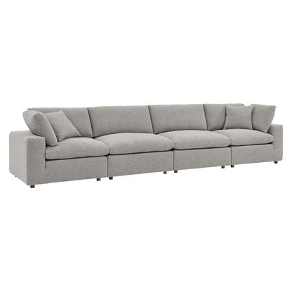 Light gray boucle fabric 4-Seater sofa with loose back cushions and wooden legs.