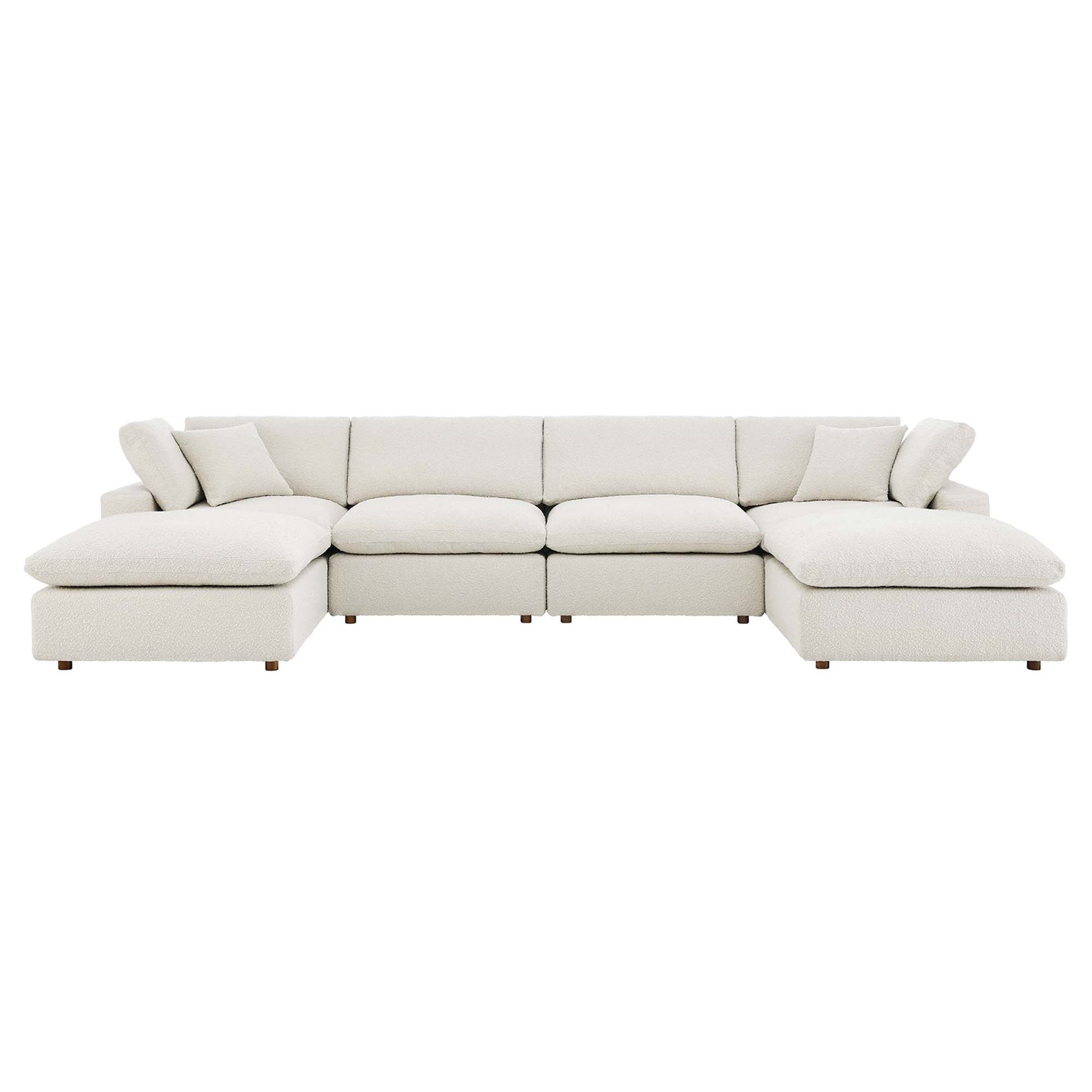 Ivory fabric sectional sofa with chaise, modular sections, plush cushions, and wooden legs.