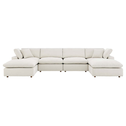 Ivory fabric sectional sofa with chaise, modular sections, plush cushions, and wooden legs.