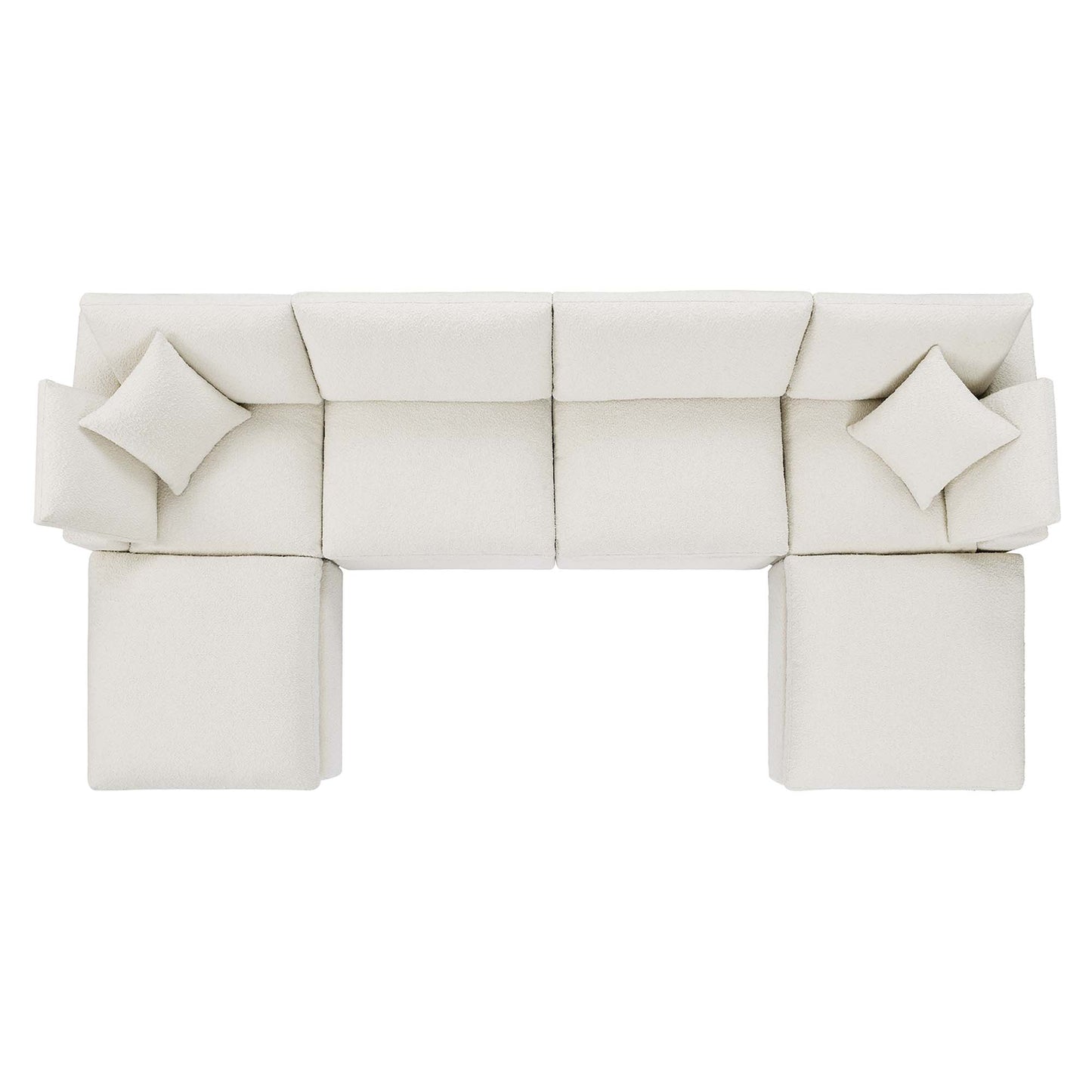 Cream ivory fabric modular sectional with matching throw pillows and ottomans, contemporary lounge.