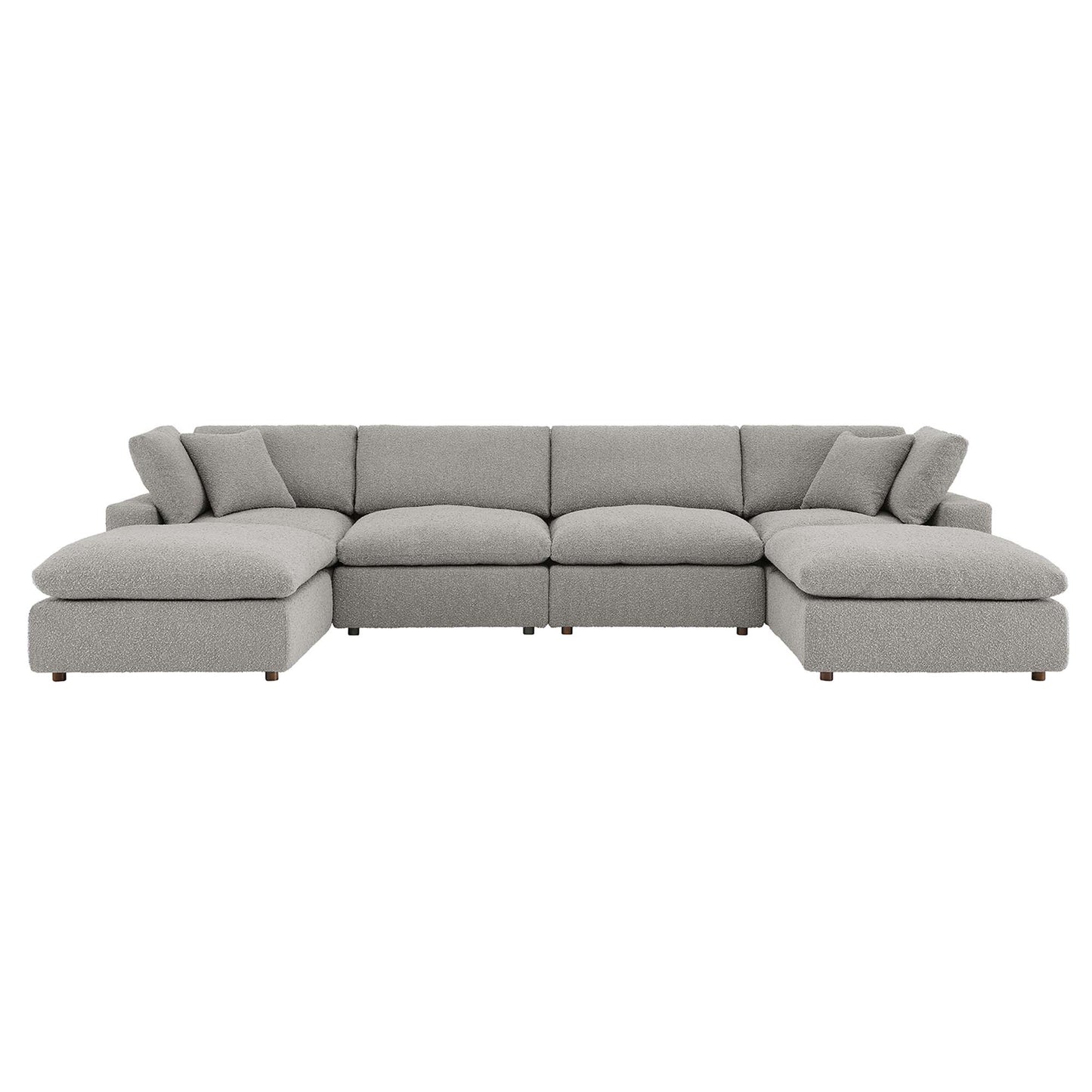 Gray fabric sectional sofa with long central seat and end chaises, plush back cushions and pillows.