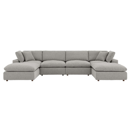 Gray fabric sectional sofa with long central seat and end chaises, plush back cushions and pillows.