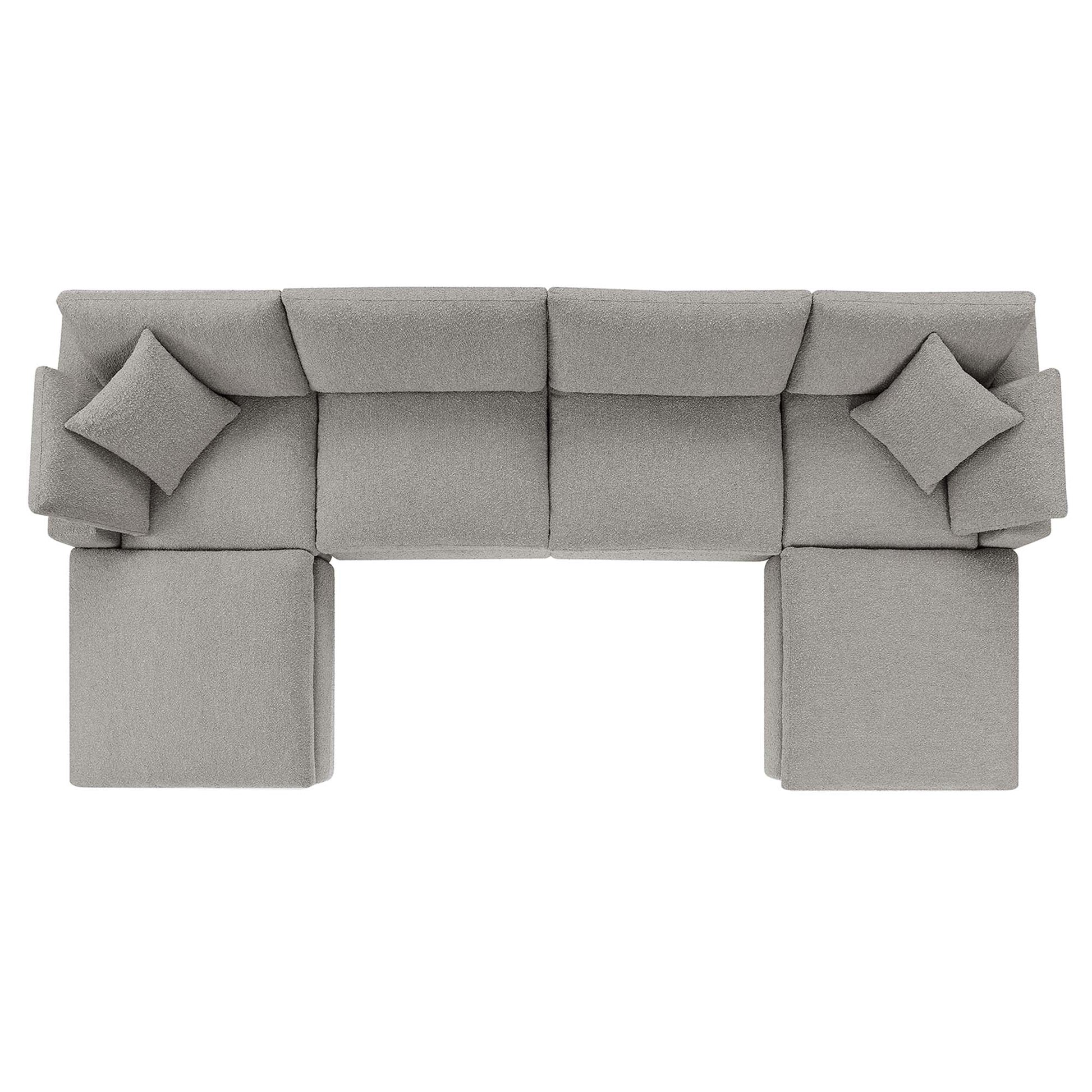 Light gray fabric modular sectional sofa with square cushions and matching ottomans for modern living room seating.