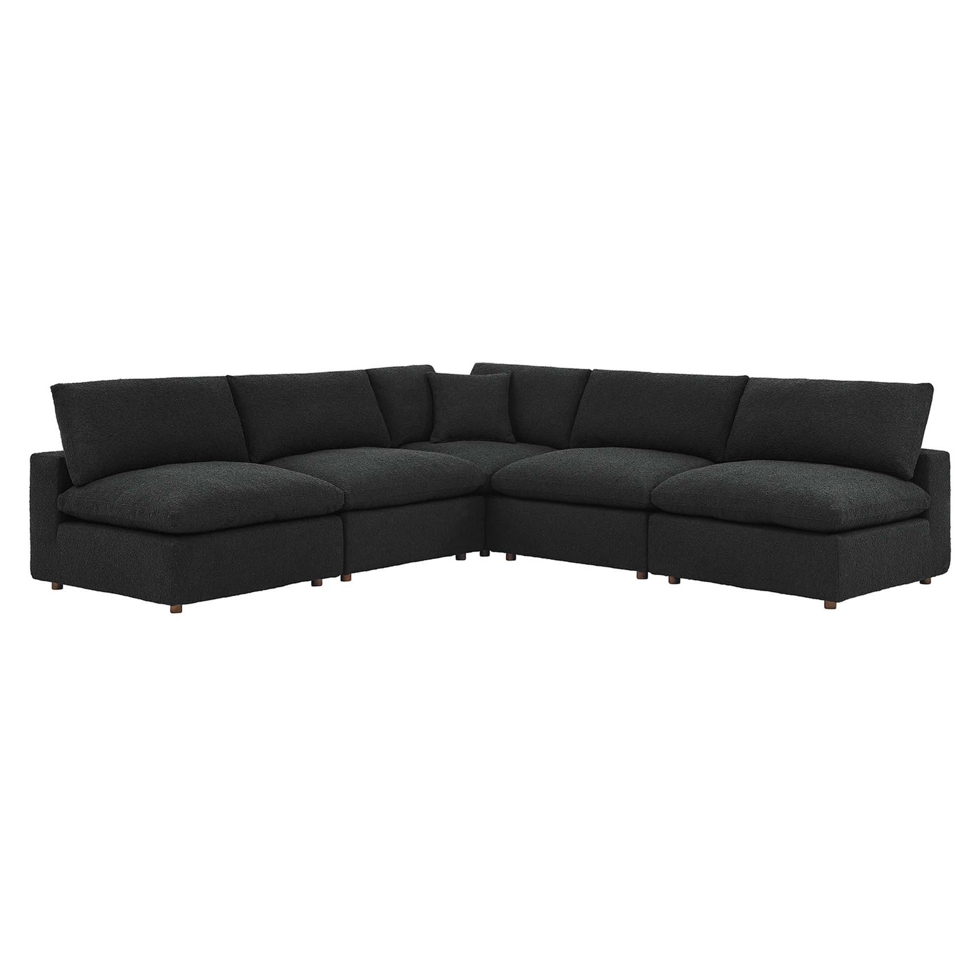 Black L-shaped sectional sofa with chaise, down-filled overstuffed cushions, low arms, boucle fabric upholstery and wooden legs.