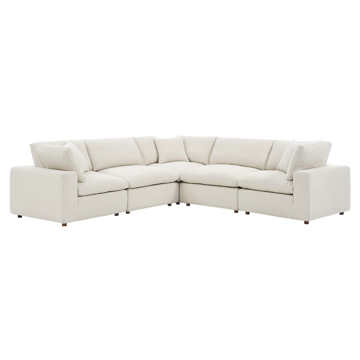 Ivory fabric sectional sofa, L-shaped with plush cushions and low arms, contemporary living room seating.