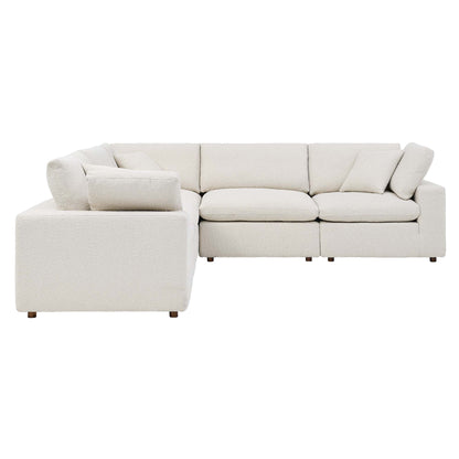Ivory fabric sectional sofa with left chaise & deep cushions & low wooden legs, modern casual living room seating.