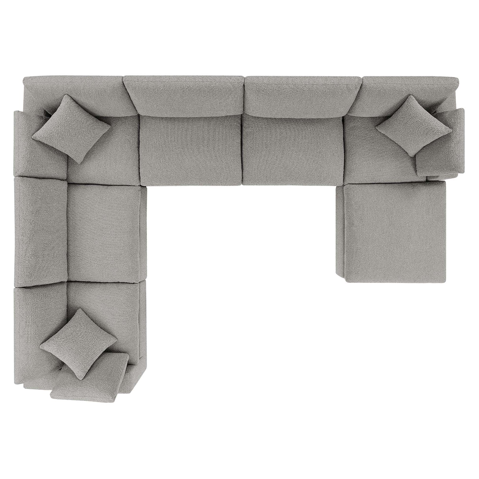 Modular light gray fabric sectional sofa in an L-shaped layout with square cushions.