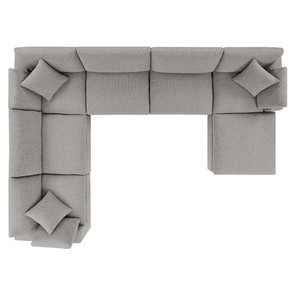 Modular light gray fabric sectional sofa in an L-shaped layout with square cushions.