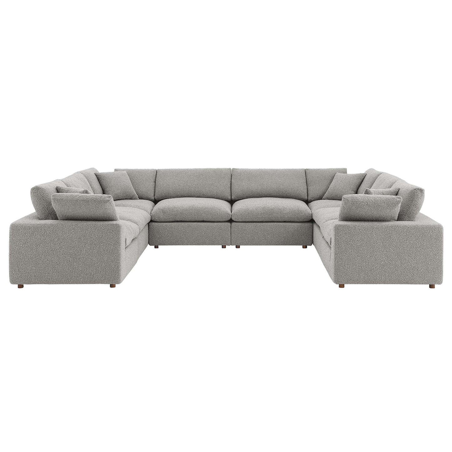 Light gray fabric modular sectional sofa with square arms, plush cushions and low wooden legs.