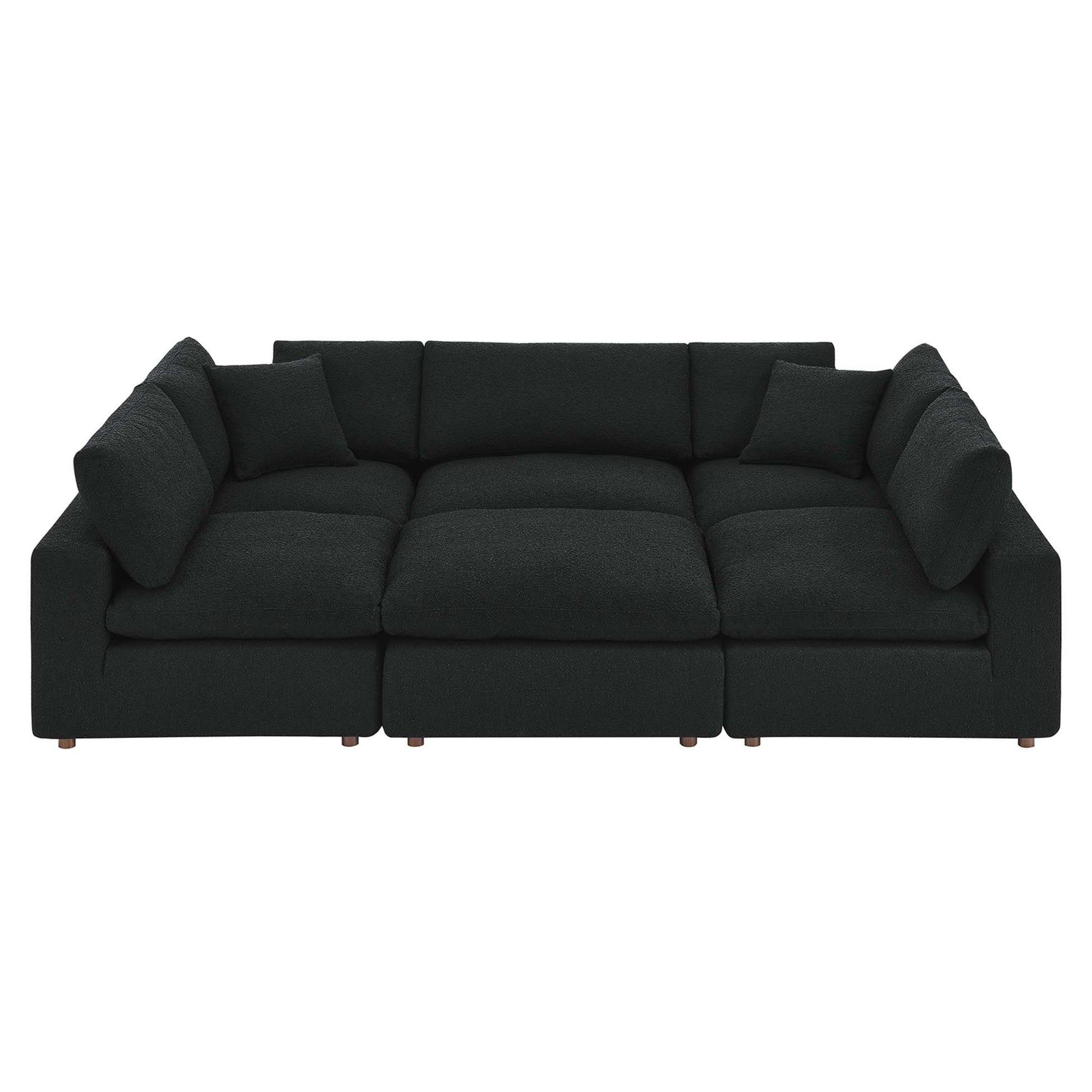 Dark charcoal boucle fabric sectional sofa with straight arms.