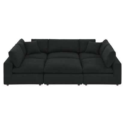 Dark charcoal boucle fabric sectional sofa with straight arms.