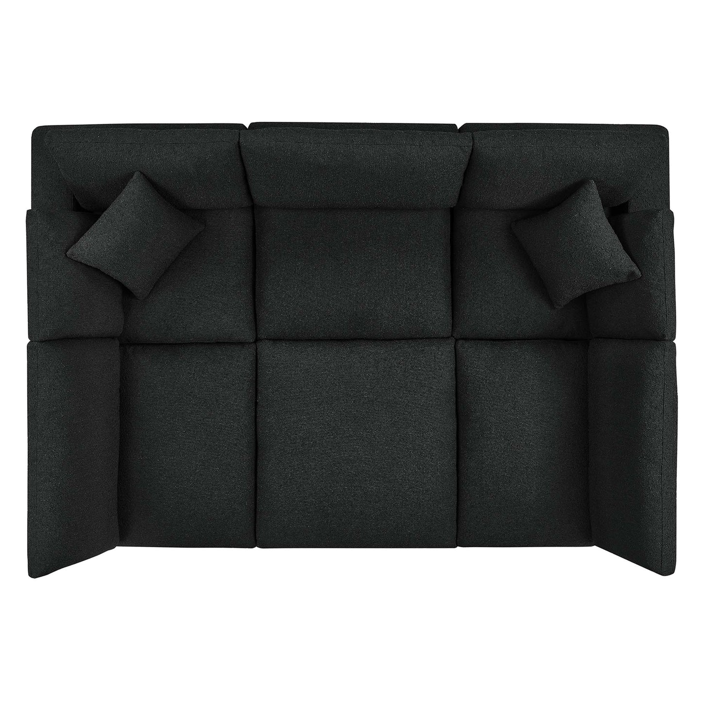 Dark charcoal boucle fabric sectional sofa with square tufted cushions and two matching throw pillows.