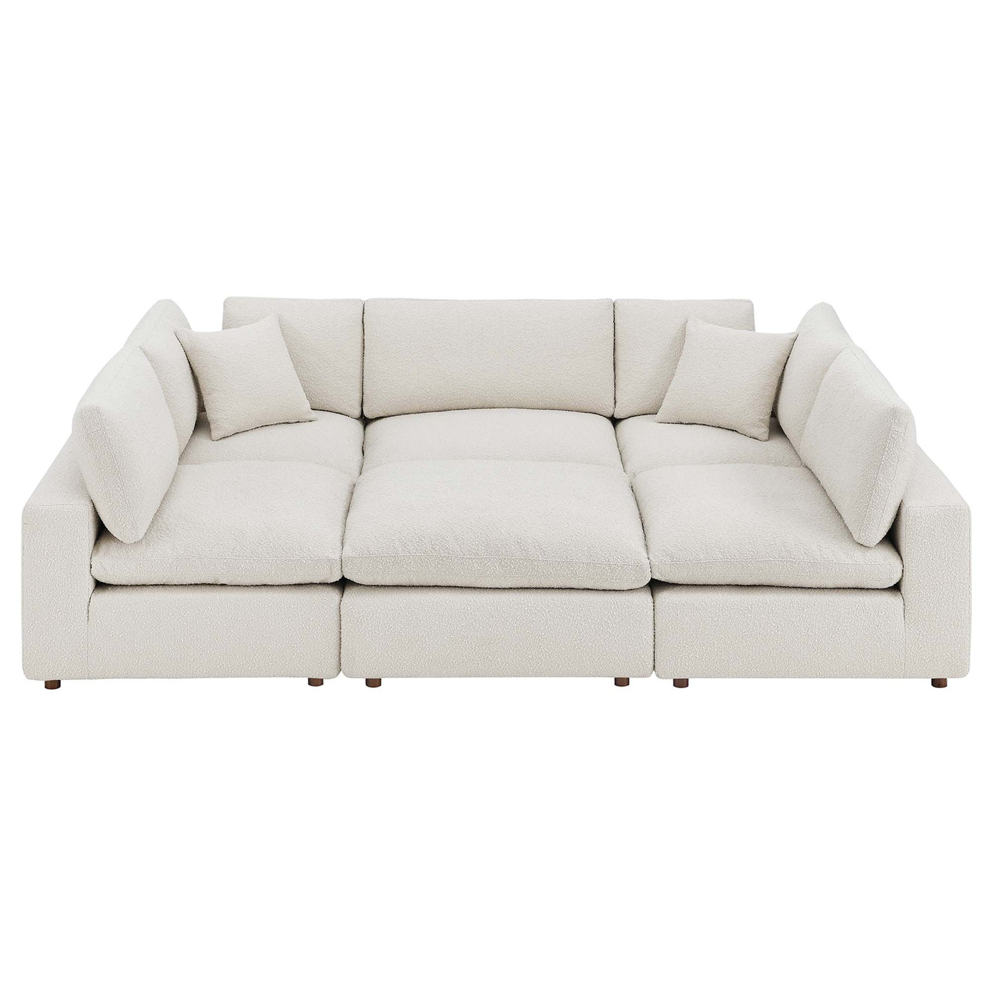 White boucle fabric 6-piece sectional sofa with down-filled, overstuffed cushions and matching back cushions.