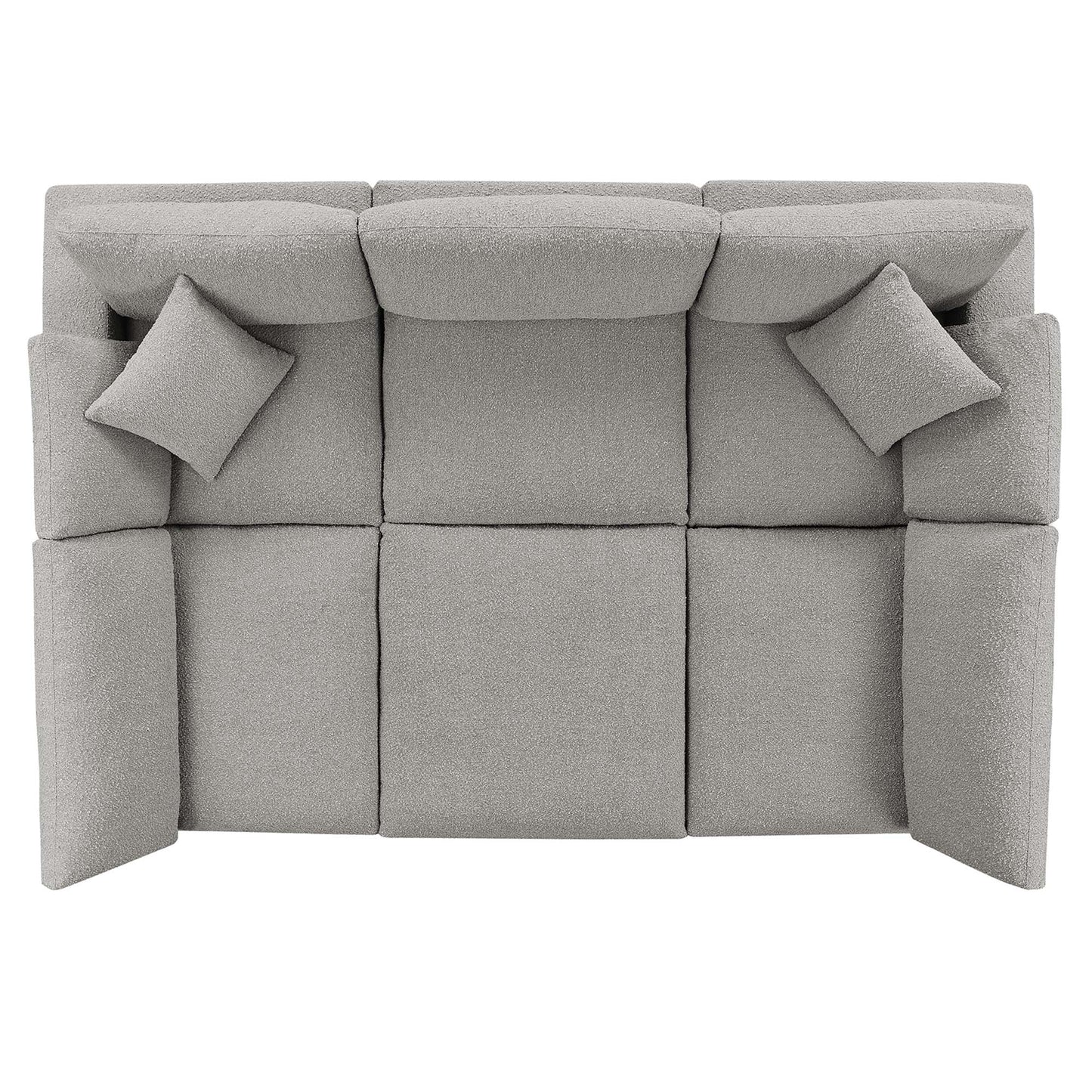 Light gray boucle fabric sectional sofa with two matching square throw pillows.