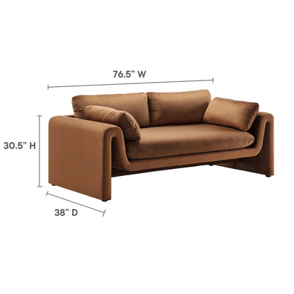 Brown velvet sofa with curved block arms and cylindrical bolster pillows, modern lounge style; 76.5W x 30.5H x 38D.