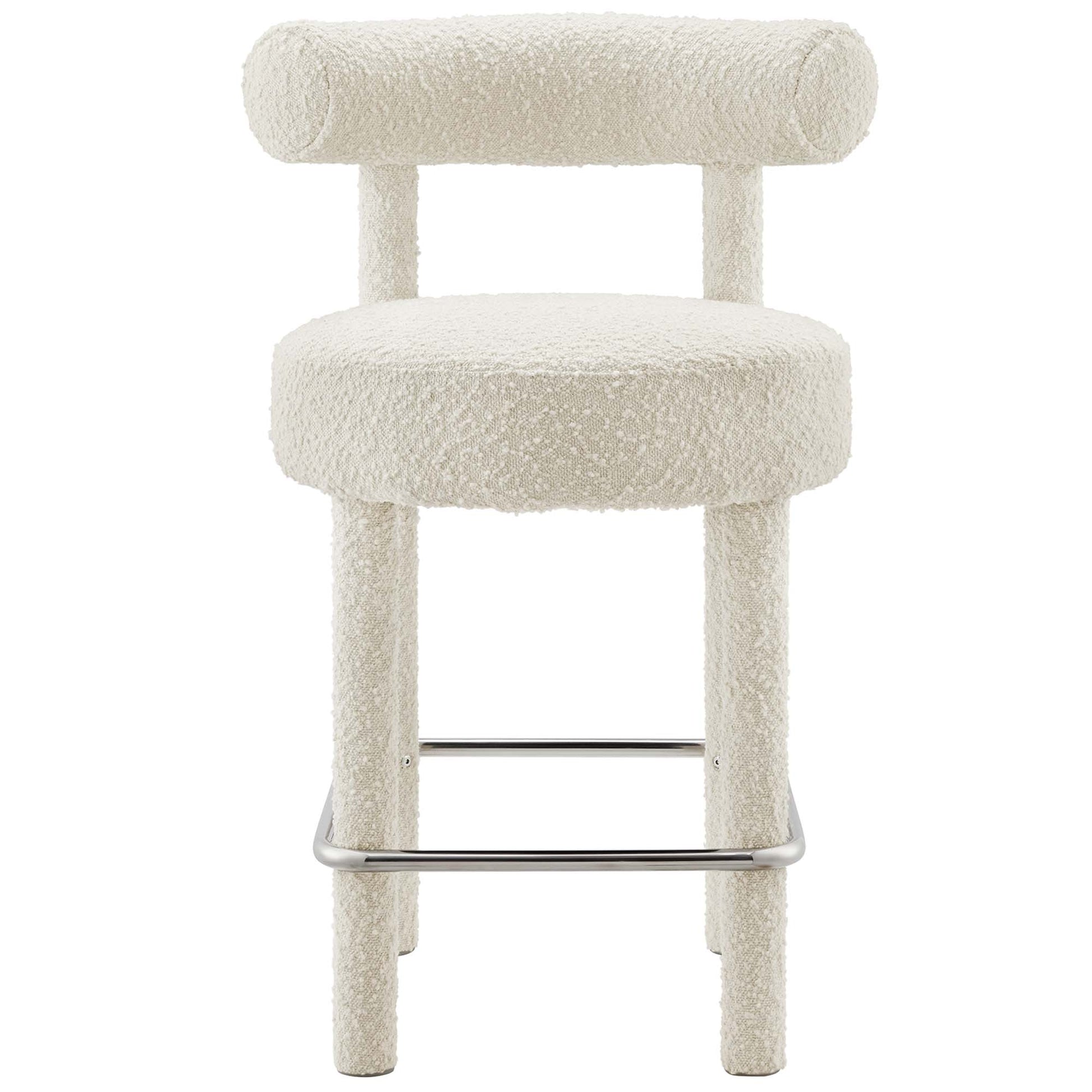 Silver boucle fabric counter stool with a low cylindrical backrest, four legs & chrome footrest for modern seating.
