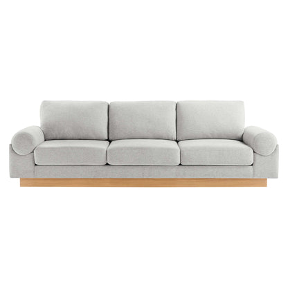 Gray fabric 3-seat sofa with rounded arm bolsters and light wood base.