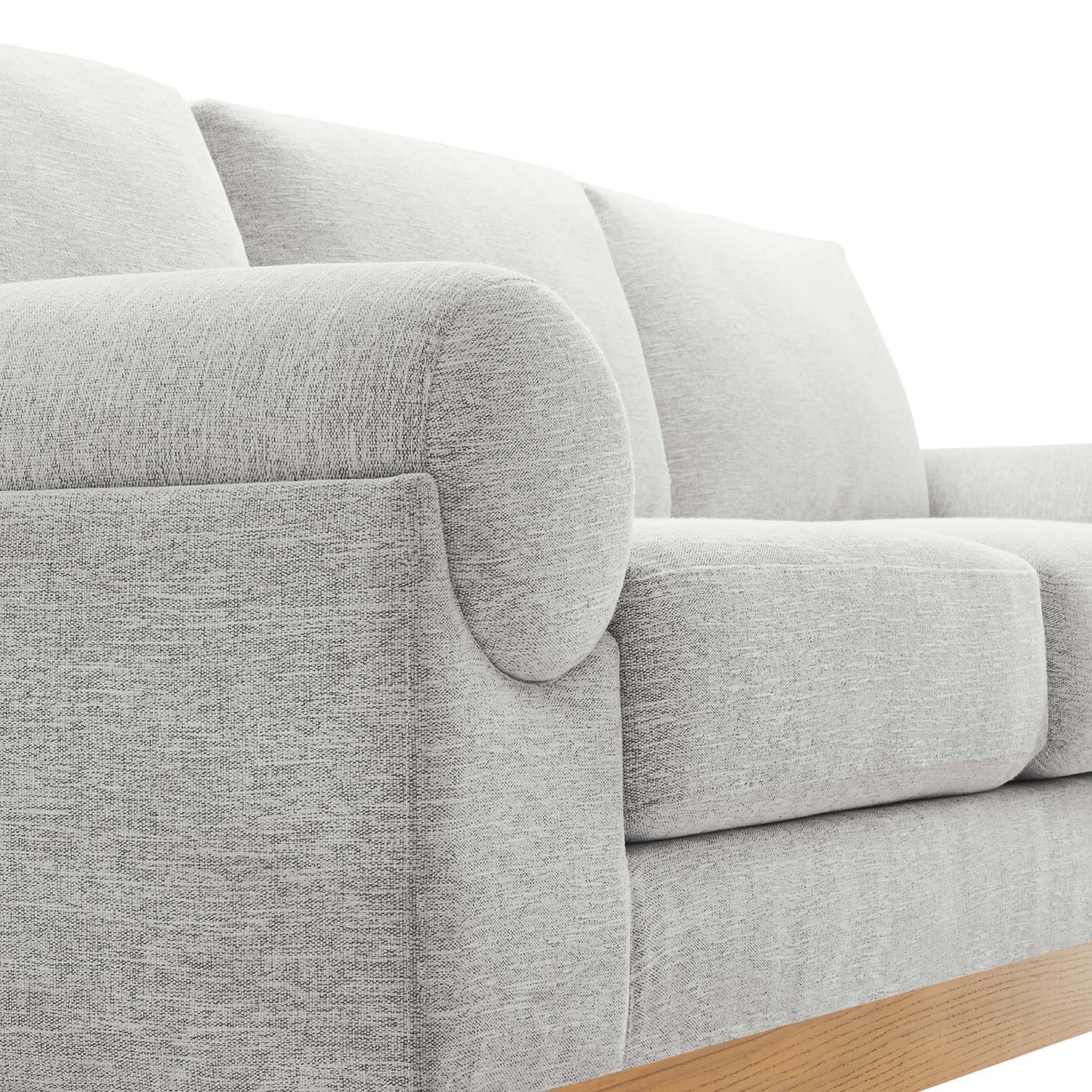 Light gray fabric sofa with rounded arms, plush cushions, and a wooden base rail.
