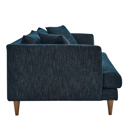 Side view of a dark blue textured fabric sofa with tapered wooden legs and cushions, mid-century style.