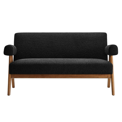 Black textured fabric loveseat with wooden legs and rounded armrest cushions; mid-century style.