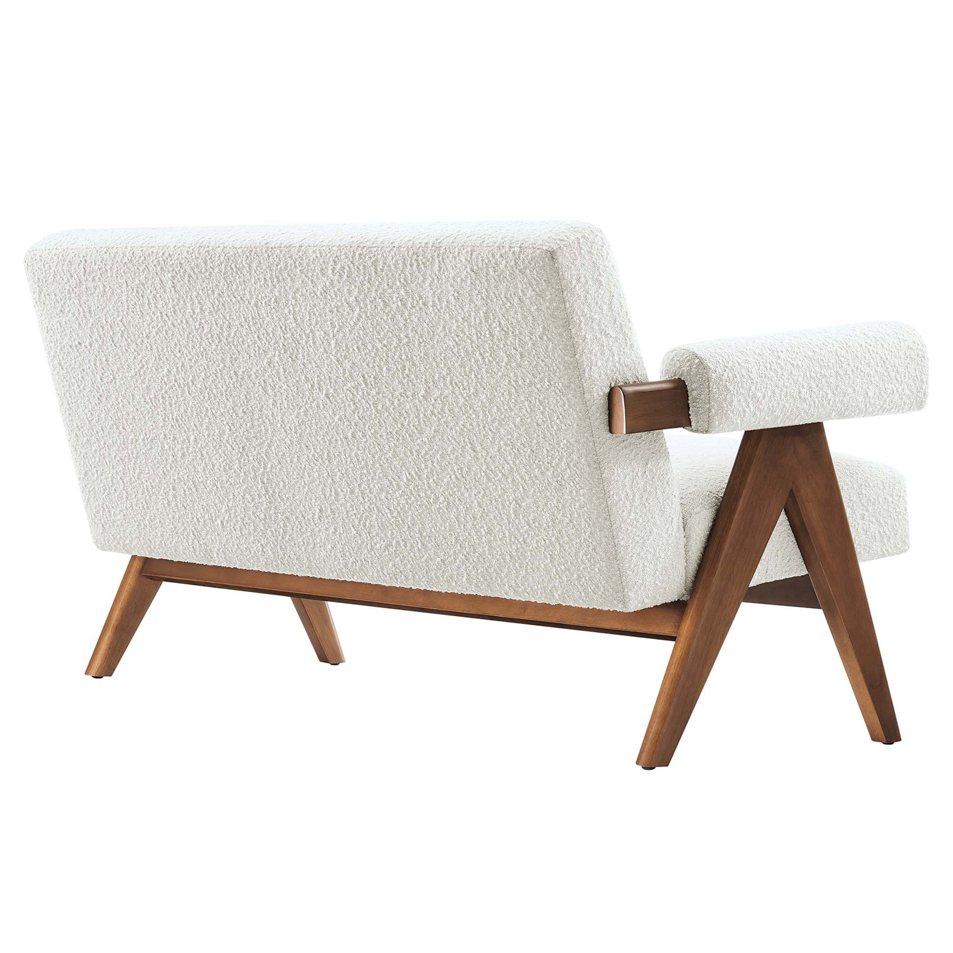 Ivory boucle upholstered mid-century loveseat with wooden angled legs and padded armrests.