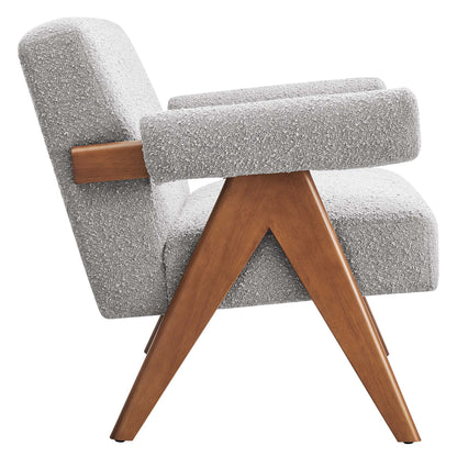 Gray boucle fabric upholstery on a mid-century-style loveseat with angled wooden legs and wooden armrests.